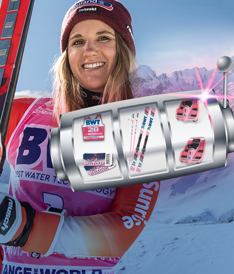 Frau steht mit Ski neben einem Glücksrad.