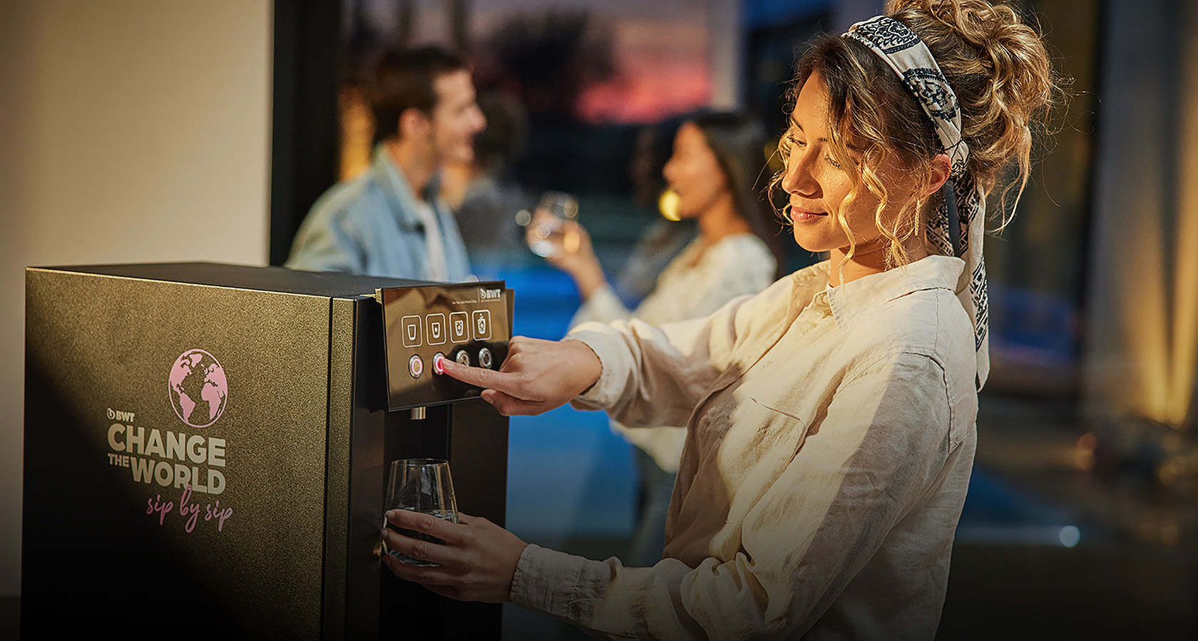 Woman using Waterdispenser