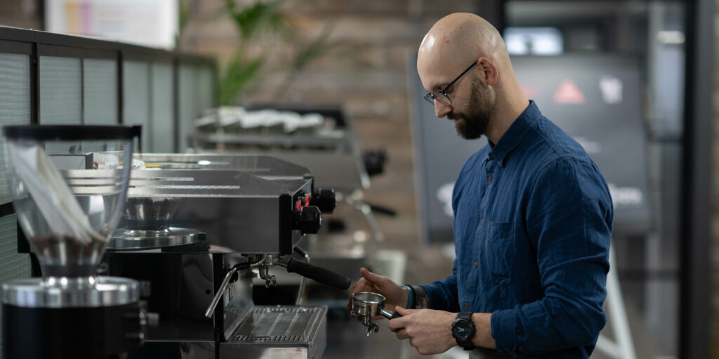A man and a coffee maker