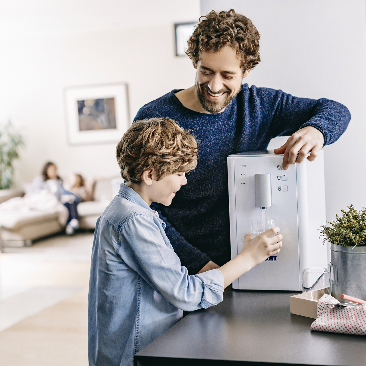 Father and son at the water dispenser
