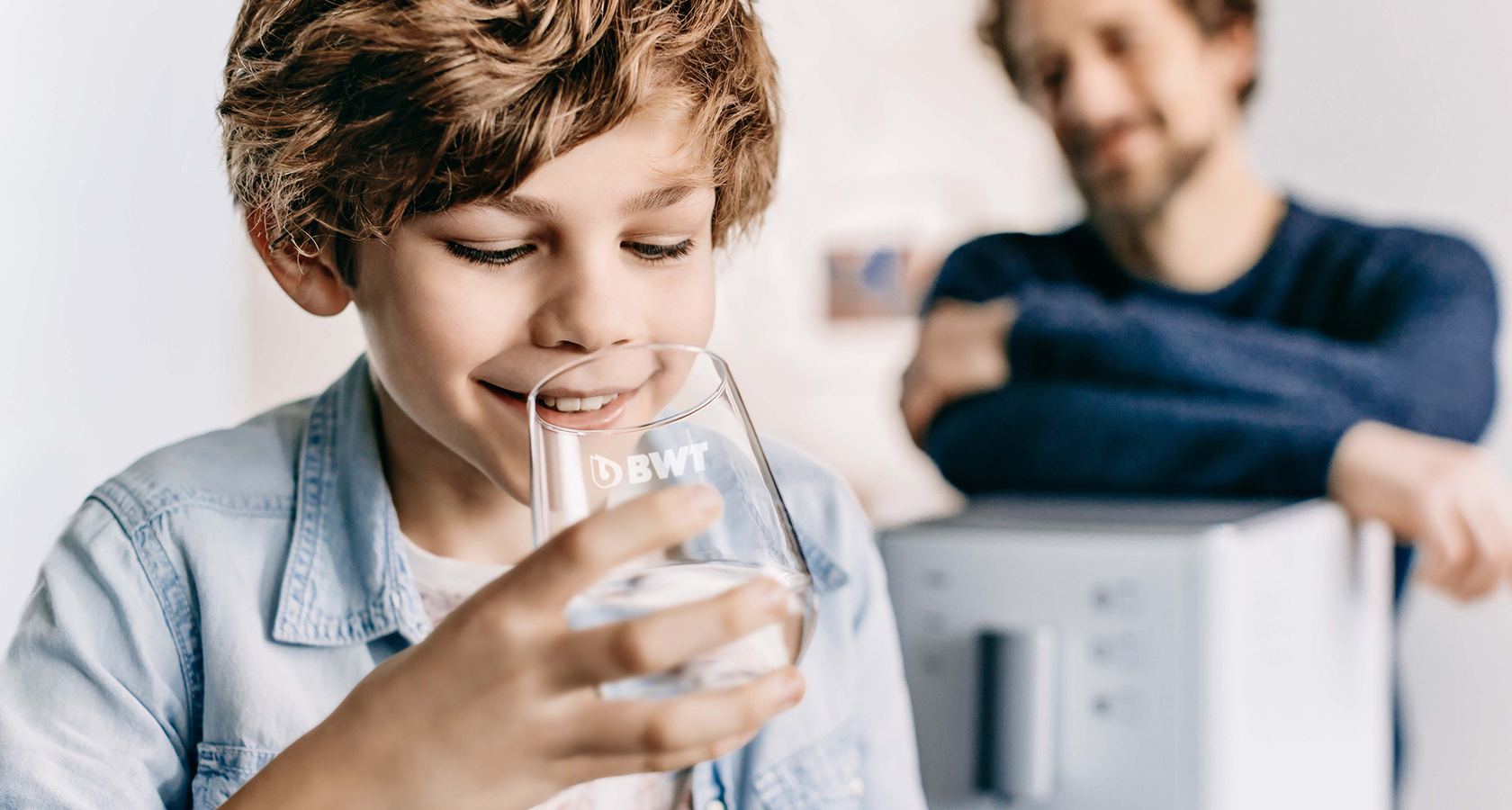 Young boy drinking water