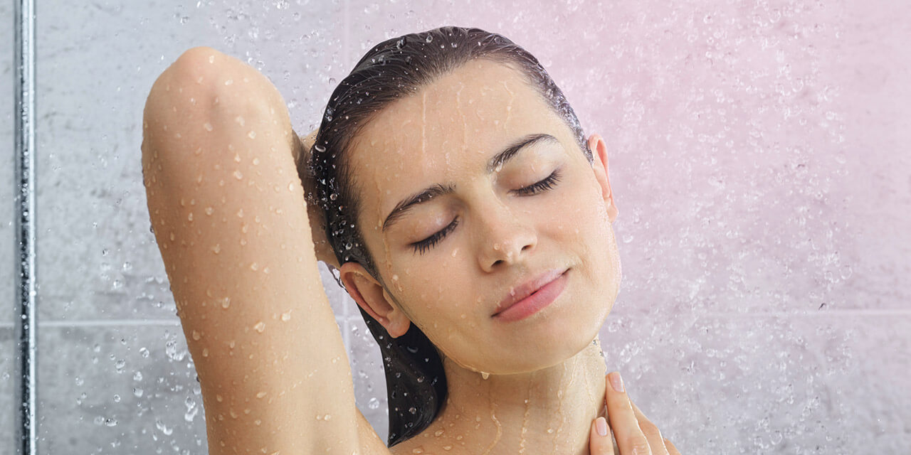 Woman enjoying a soft water shower