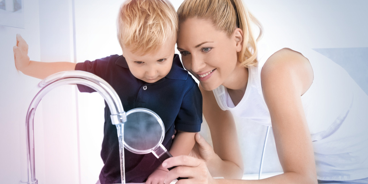 Woman with child looking at water