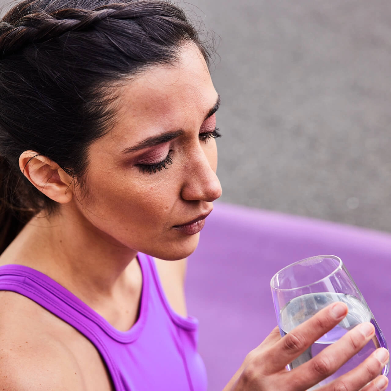 Athletic woman with glass of water