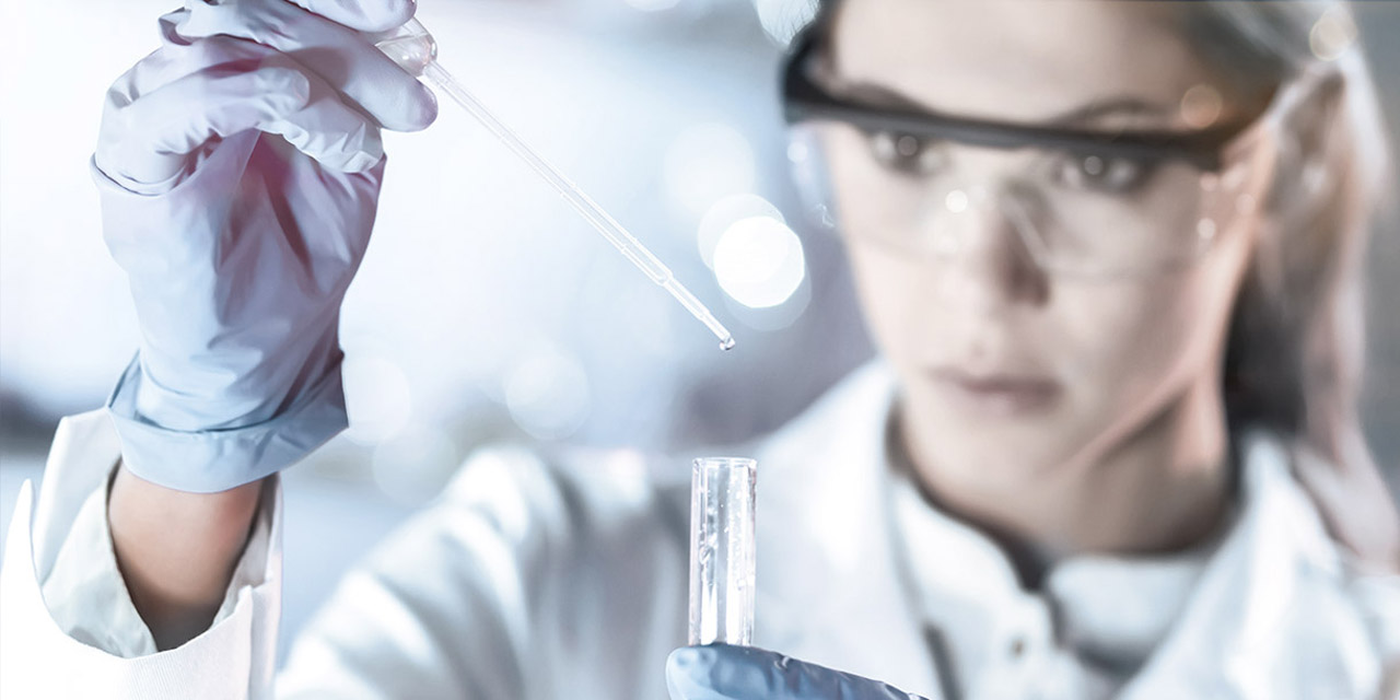 Female chemist analyzing purified water