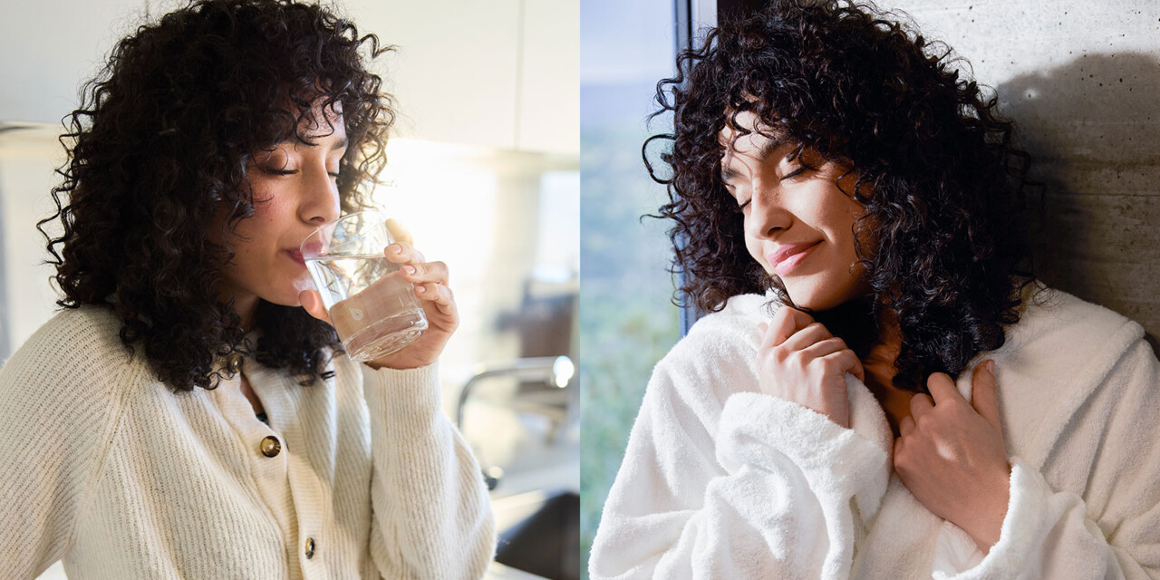 A woman with curly hair enjoys a glass of water in a bright kitchen, followed by a moment of relaxation in a cozy robe.