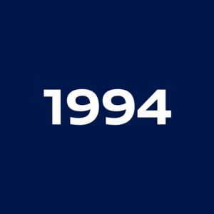 White, bold number '1994' on a dark blue background.