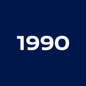 White, bold numbers show the year 1990 against a plain dark blue background.